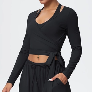 Detail of cross-wrap yoga top with side ties and high-elastic moisture-wicking fabric