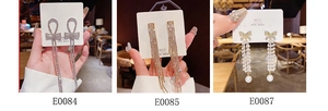 Close-up of S925 silver needle tassel earrings with rhinestones and pearls