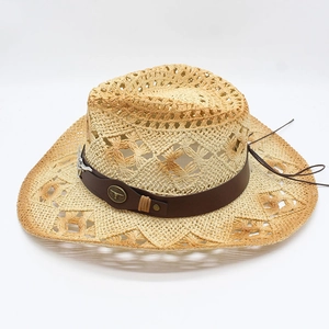 Beige hollow woven straw cowboy hat with leather band and vintage metal bull emblem