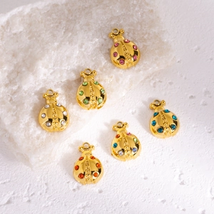 Set of six gold ladybug pendants with colorful rhinestones for DIY jewelry making