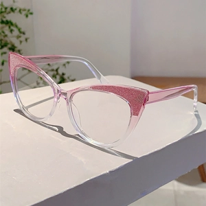Detailed view of cat-eye frames with pink gradient and glitter texture on a white stand