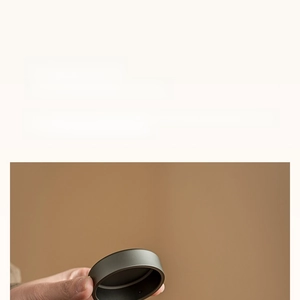 Detail showing high-quality dark grey double-layered aluminum lid for tea canister sealing