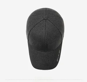 Detailed top view of a dark charcoal grey baseball cap with embroidery and soft texture