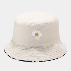 Detail of daisy embroidery on beige canvas bucket hat with printed inner brim lining