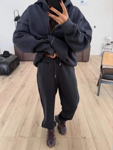 Women's dark grey hooded zip-up sweatshirt and high-waisted jogger set for casual wear