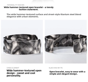 Close-up of a wide hammered titanium steel open cuff bracelet with vintage ripple texture