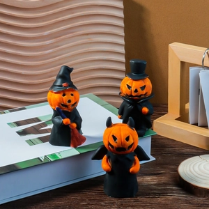 Three Halloween pumpkin character figurines including witch, gentleman, and devil styles