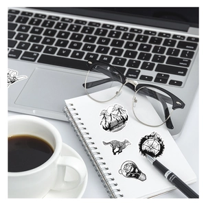 Detailed view of black and white gothic stickers with mountain and compass designs