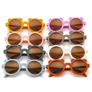 Detail of round matte baby sunglasses with cute bear ears in eight diverse colors