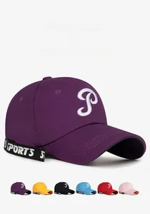 Detail view of colorful baseball caps featuring white P embroidery and sports side ribbons