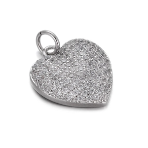 Detail of silver heart pendant featuring full pave setting of sparkling clear zircons