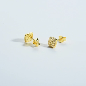 Detail of square S925 silver stud earrings with gold plating and paved zircon stones