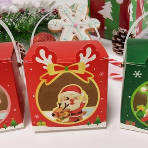 Christmas gift boxes with Santa and reindeer patterns and transparent windows