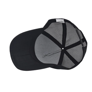 Detail view of cotton baseball cap interior showing 100% cotton label and mesh structure