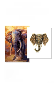 Detail of vintage elephant brooch with amber rhinestones on antique gold finish