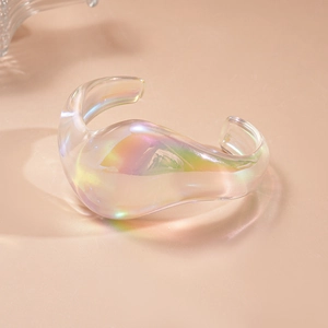 Detail showing the iridescent acrylic geometric bangle with rainbow aura finish