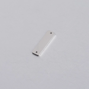 Detailed macro view of a 6x22mm silver rectangular stainless steel tag with dual holes