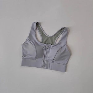 Front zipper high-impact sports bra in light purple with breathable mesh racerback design