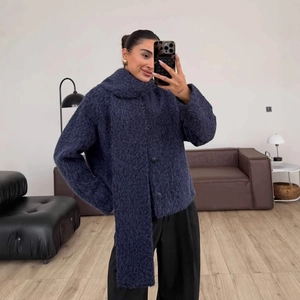Navy blue textured wool coat with large buttons and long sleeves for winter fashion