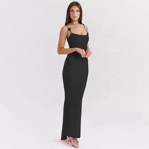 Detail of black backless maxi dress with bow shoulder straps and elegant pleats