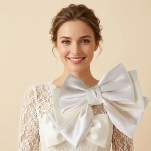 Detailed close-up of ivory satin hair clip showing layered fabric texture and clip