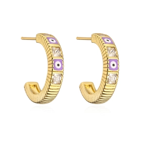 Detailed view of C-shaped gold hoop earrings with purple evil eye and zircon inlay