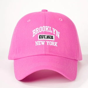 Close-up of Brooklyn New York 3D embroidery on bright pink cotton baseball cap