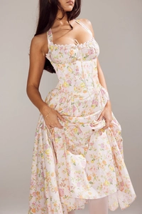 Detail of floral lace trim and corset waist design on summer midi dress