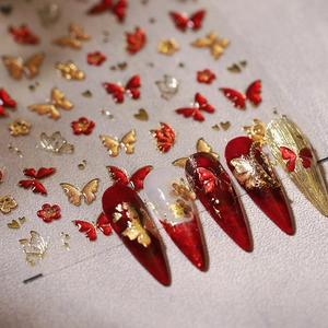 Stickers à ongles papillon rouge et or pour manucures élégantes et nail art de luxe