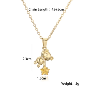 Detail shot of gold-plated bear and star pendant with precise measurements and 45cm chain