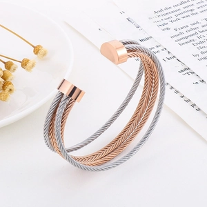 Multilayer C-shaped woven stainless steel bracelet in rose gold and silver bicolor