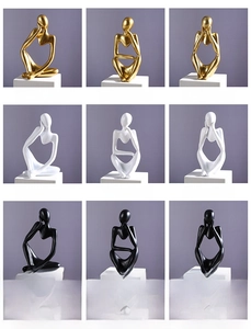 Grid view of abstract thinker resin sculptures in gold, white, and black finishes
