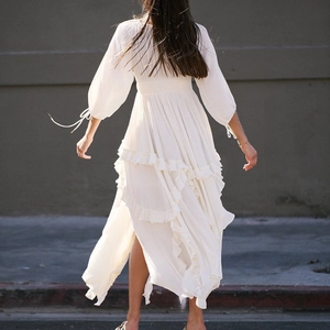 White bohemian U-neck maxi dress with tiered ruffles and lace stitching details