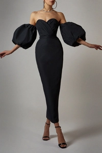 Detail view of black off-shoulder evening dress with elegant satin finish and lantern sleeves