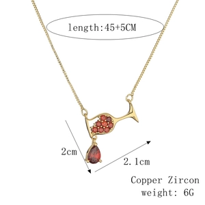 Detailed view of wine glass pendant necklace with red cubic zirconia and dimensions