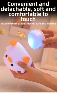 Detail of the detachable food-grade silicone chick night light showing its inner LED core