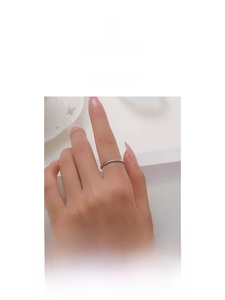 Macro shot of minimalist S925 sterling silver ring with micro-pave cubic zirconia