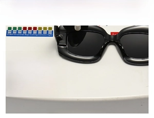 UV400 protection test showing black irregular sunglasses blocking ultraviolet rays