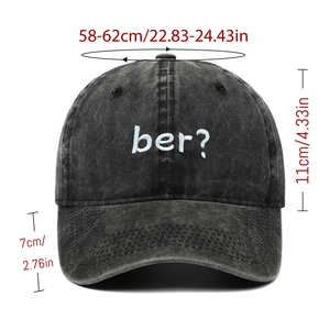 Detail of vintage washed black cotton baseball cap with white ber? embroidery and size data