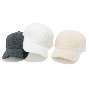 Detailed texture view of plush baseball caps in grey, white, and beige fleece fabric