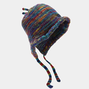Macro detail of multi-color rainbow knit beanie with braided earflaps and horn accents