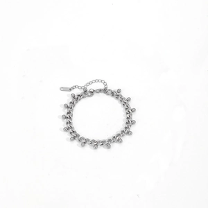 Silver stainless steel cuban chain anklet with round bead pendants on white background