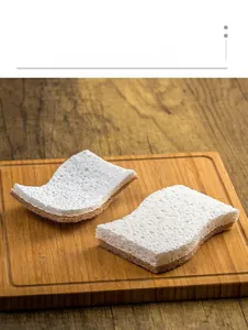 Detail of natural wood pulp sponge with honeycomb structure and brown scrubbing layer