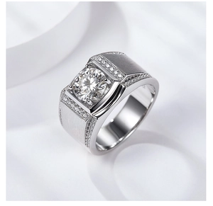 Macro shot of 2ct moissanite ring showing brushed silver finish and pave side diamonds