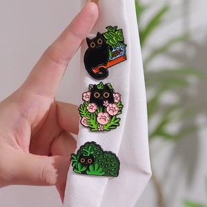 Three cute black cat enamel pins set featuring flower plants for clothing and bags