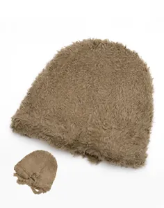 Detail of the plush knit beanie reverse side showing soft texture and thermal fabric