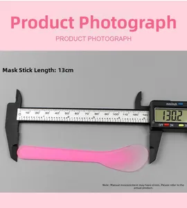 Pink translucent facial mask mixing spatula showing precise 13cm length measurement