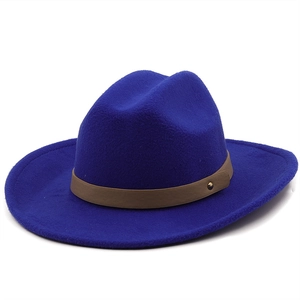 Detailed close-up of dark blue wool fedora with brown leather band and gold rivet