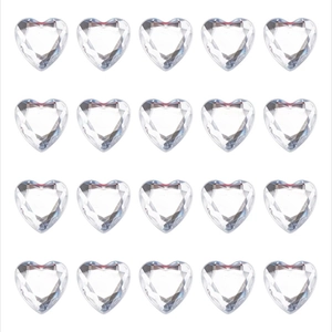 Macro detail of faceted heart-shaped clear acrylic crystals for DIY craft projects