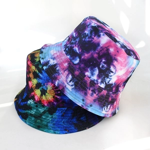 Detail of vibrant tie-dye bucket hats showing rich stitching on the brim and canvas texture